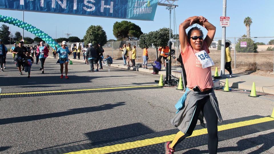 los angeles, california september 29 doria ragland crosses the finish line at the 21st annual alive and running 5k for suicide prevention on september 29, 2019 in los angeles, california photo by robin l marshallgetty images