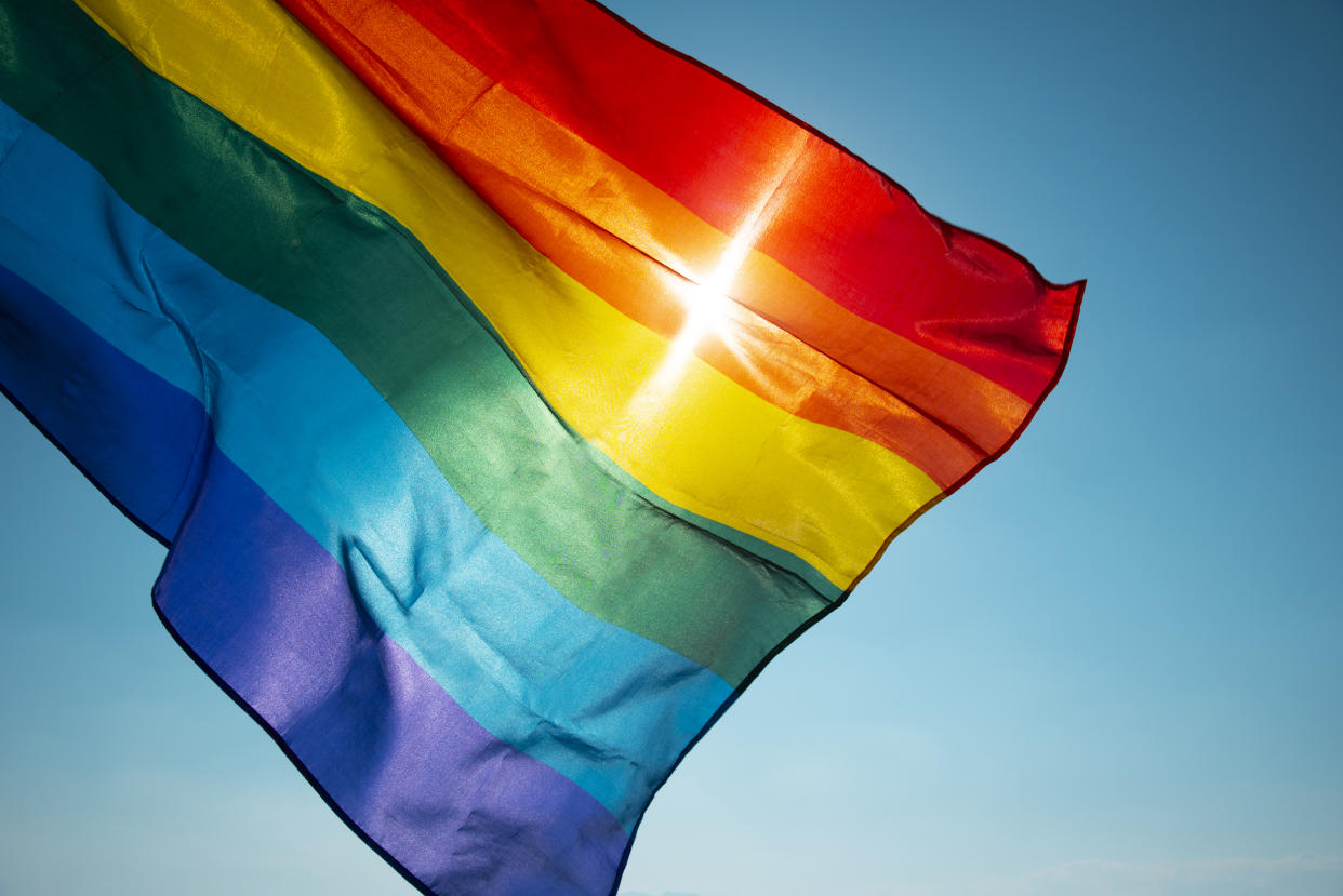 A rainbow flag can indicate a refuge — which is why some are upset that schools and towns across the country are banning them. (Photo: Getty Images)