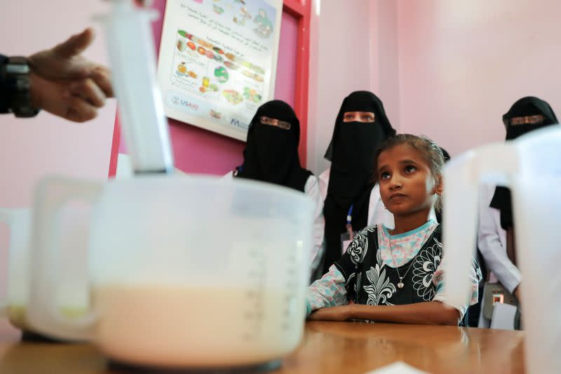 Malnourished girl Ahmadiya Juaidi waits to received a supplemental nutrition shake she received at malnutrition treatment ward of al-Sabeen hospital in Sanaa