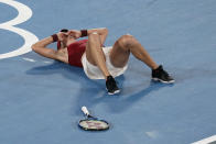 Belinda Bencic, of Switzerland, reacts after defeating Marketa Vondrousova, of the Czech Republic, in the women's gold medal match of the tennis competition at the 2020 Summer Olympics, Saturday, July 31, 2021, in Tokyo, Japan. (AP Photo/Patrick Semansky)