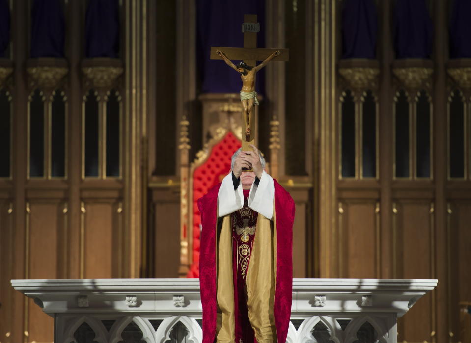 Cardinal Thomas Collins delivers an online Good Friday service in an empty St. Michael's Cathedral in Toronto on Friday, April 10, 2020. Health officials and the government have asked that people stay inside to help curb the spread of COVID-19. (Nathan Denette/The Canadian Press via AP)