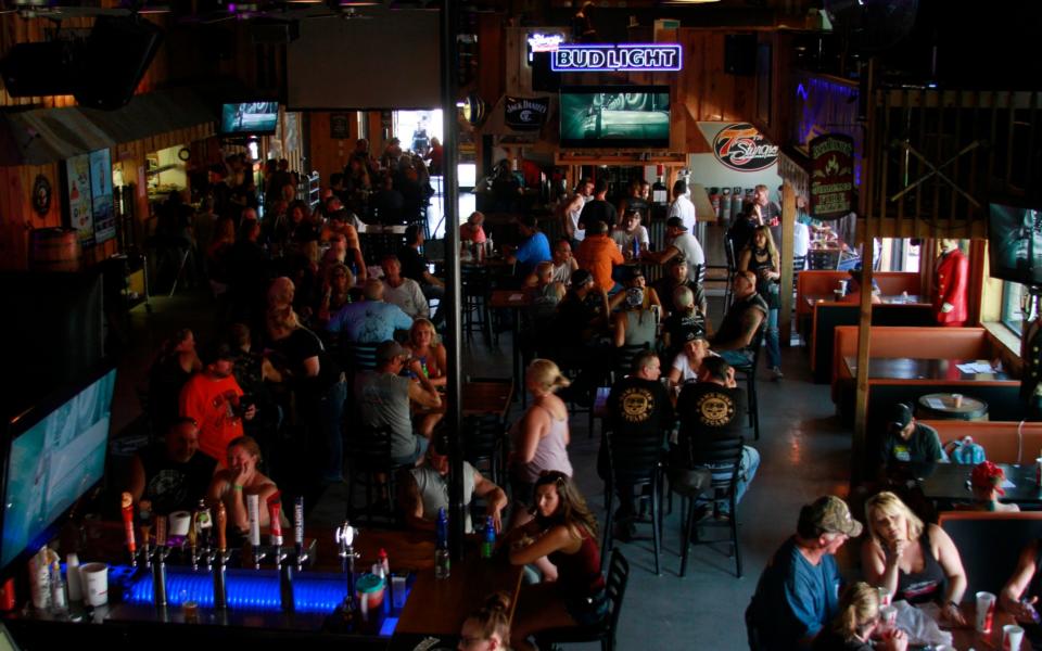 People fill a bar during the Sturgis Motorcycle Rally in South Dakota - AP Photo/Stephen Groves