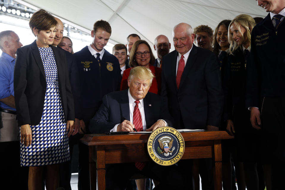 President Donald Trump signs an executive order to streamline the approval process for GMO crops, after speaking at Southwest Iowa Renewable Energy in Council Bluffs, Iowa, Tuesday, June 11, 2019. (AP Photo/Patrick Semansky)