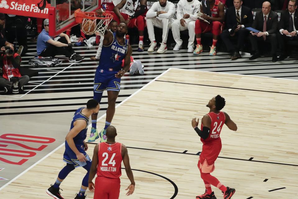 LeBron James of the Los Angeles Lakers dunks during the second half of the NBA All-Star basketball game Sunday, Feb. 16, 2020, in Chicago. (AP Photo/David Banks)