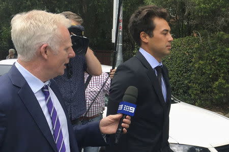 Former professional tennis player and coach Nick Lindahl (R) leaves an Australian court after pleading guilty to one charge related to tennis match-fixing, in Sydney, Australia, January 25, 2016. REUTERS/Matt Siegel