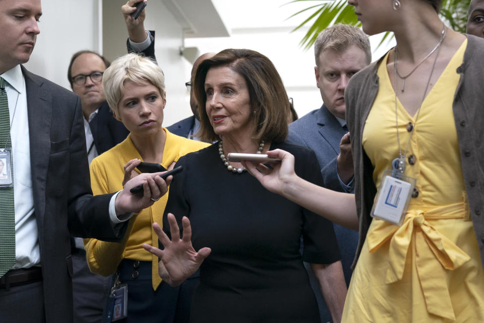 Speaker of the House Nancy Pelosi, D-Calif., is surrounded by reporters as she arrives to meet with her caucus the morning after declaring she will launch a formal impeachment inquiry against President Donald Trump, at the Capitol in Washington, Wednesday, Sept. 25, 2019. (Photo: J. Scott Applewhite/AP)