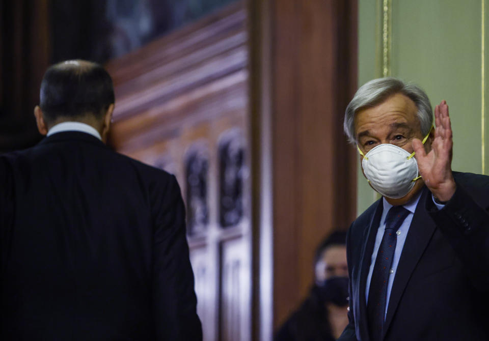 UN Secretary-General Antonio Guterres, right, waves to journalists while leaving a joint news conference with Russian Foreign Minister Sergey Lavrov, left back to a camera, following their talks in Moscow, Russia, Wednesday, May 12, 2021. (Maxim Shemetov, Pool via AP)