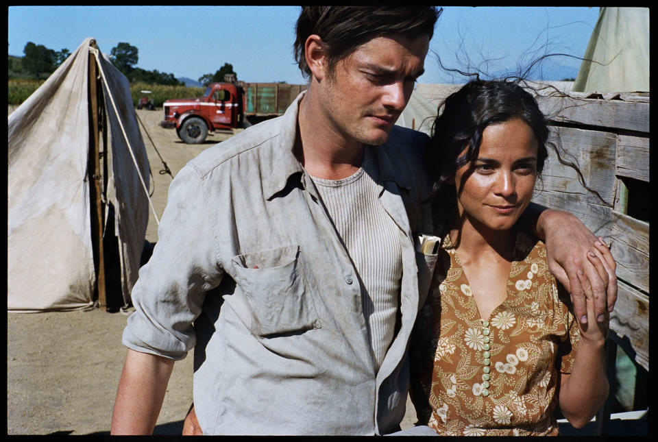 This undated publicity film image released by IFC Films/Sundance Selects shows Sam Riley, left, as Sal Paradise/Jack Kerouac and Alice Braga, as Terry/Bea Franco in a scene from the film, "On the Road," directed by Walter Salles. (AP Photo/IFC Films/Sundance Selects, Gregory Smith)