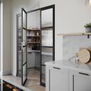 <p>This striking walk-in pantry has glass doors, sleek grey cabinets and wooden shelves for kitchen accessories. </p><p>• See more from <a href="https://www.kinbymowlem.com/" rel="nofollow noopener" target="_blank" data-ylk="slk:Kin by Mowlem;elm:context_link;itc:0;sec:content-canvas" class="link ">Kin by Mowlem</a></p>