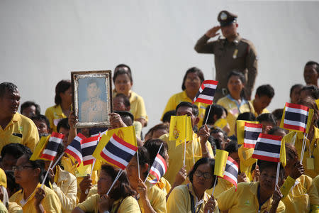 People wait for a coronation procession for Thailand's newly crowned King Maha Vajiralongkorn in Bangkok, Thailand May 5, 2019. REUTERS/Athit Perawongmetha