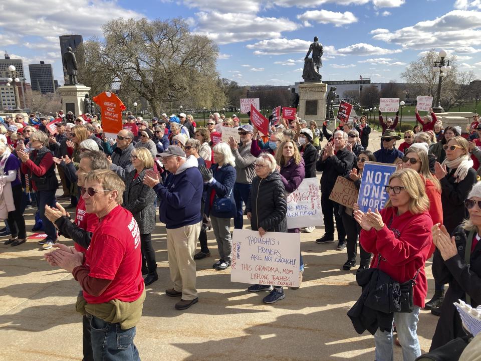 Gun safety advocates rally on the steps of the Minnesota State Capitol on Tuesday, April 25, 2023, in support of gun safety legislation that was scheduled for debate in the Minnesota House in Saint Paul, Mich. (AP Photo/Steve Karnowski)