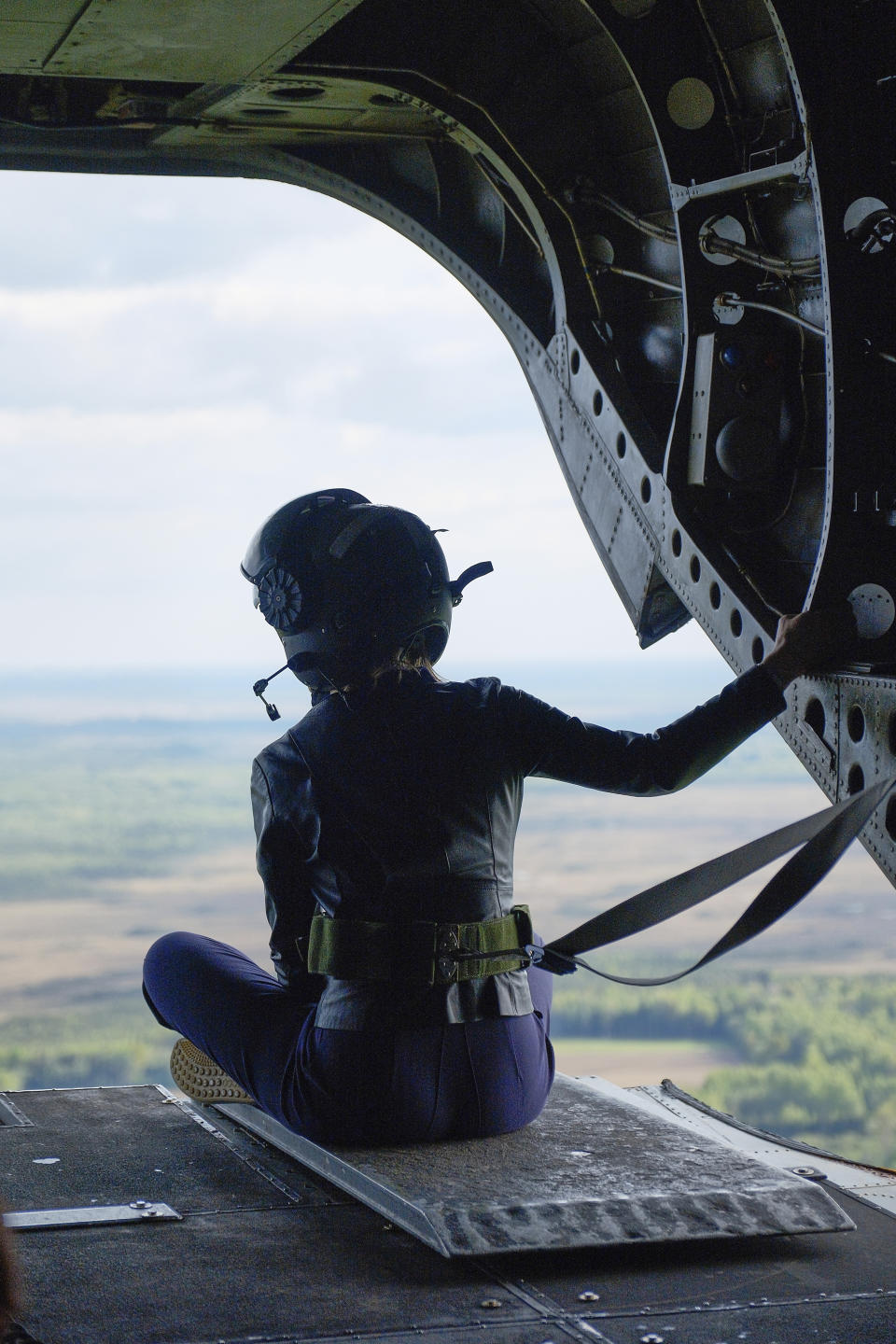 Estonian Prime Minister Kaja Kallas sits inside a British Chinook helicopter in Estonia, Wednesday, May 15, 2024. Kallas has called for a "serious" coordinated approach to deter and counter Russian hybrid attacks on European soil. (AP Photo/Hendrik Osula)