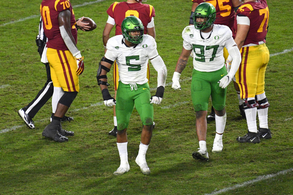 LOS ANGELES, CA - DECEMBER 18: Oregon Ducks defensive lineman Kayvon Thibodeaux (5) celebrates a sack during the Pac-12 Championship college football game between the Oregon Ducks and the USC Trojans on December 18, 2020, at Los Angeles Memorial Coliseum in Los Angeles, CA. The game was played without fans due to the COVID-19 pandemic. (Photo by Brian Rothmuller/Icon Sportswire via Getty Images)