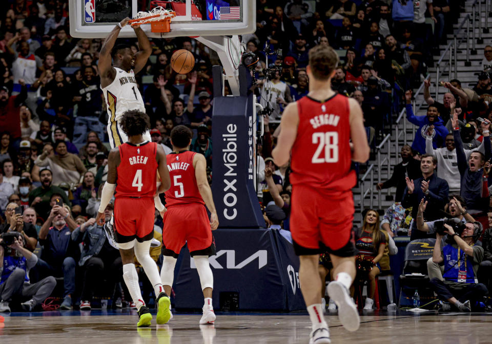 New Orleans Pelicans forward Zion Williamson (1) dunks against the Houston Rockets during the first half of an NBA basketball game in New Orleans, Thursday, Feb. 22, 2024. (AP Photo/Derick Hingle)