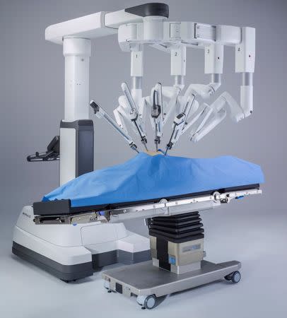 Intuitive Surgical's da Vinci Xi robot-assisted system is integrated with a patient operating room table that can be adjusted during the procedure is shown in this image taken in Sunnyvale, California, U.S. in 2015. Courtesy Intuitive Surgical/Handout via REUTERS