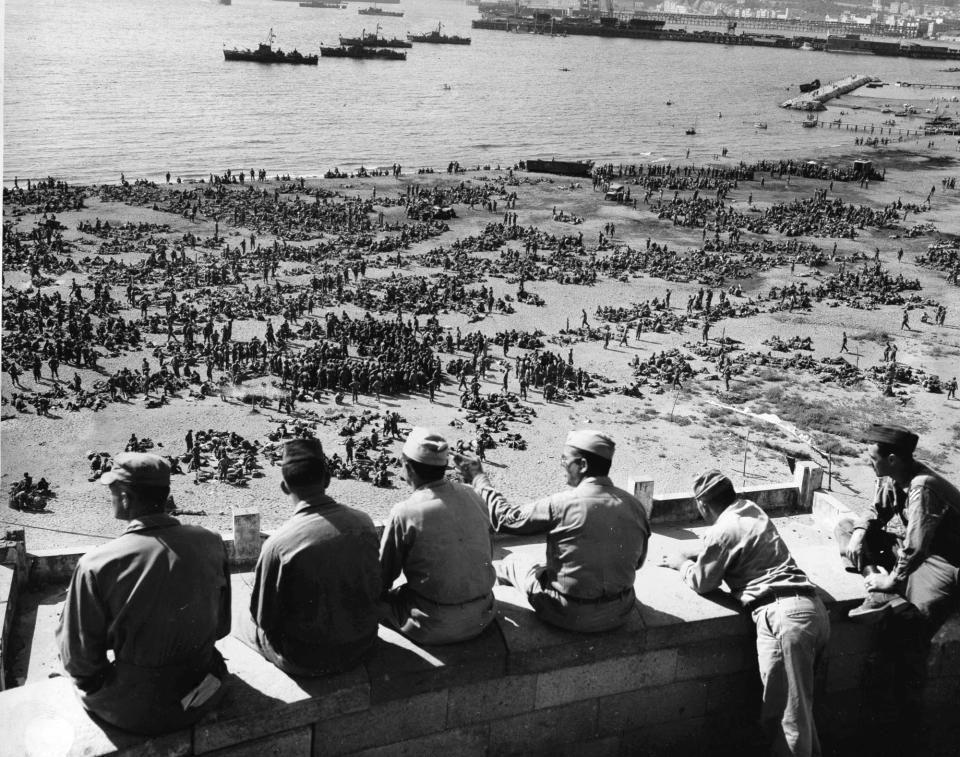 FILE - In this Aug. 10, 1944 file photo, thousands of U.S. 3rd Division troops wait to board Landing Ships Tanks on an unidentified beach in Italy in preparation for Operation Dragoon. First intended to coincide with the landings in Normandy, the operation was delayed due to lack of resources. Carried out by French and American troop, it started on August 15, 1944. For Allied troops in western Europe, D-Day was just the beginning of a long and bloody push toward victory over the Nazis. Ten weeks after commemorating the 75th anniversary of the D-Day invasion in Normandy, France is paying tribute this week to Allied troops involved in another major, but often overlooked, military operation: landings on the Mediterranean coast. (AP Photo, File)