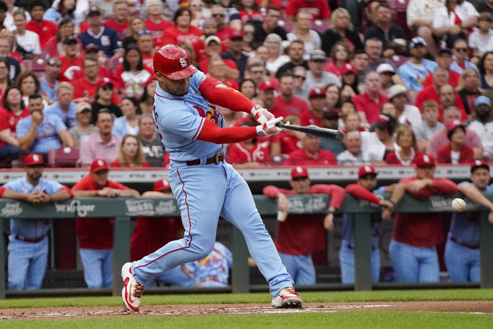 CORRECTS TO CARDINALS' WILLSON CONTRERAS NOT CARDINALS' NOLAN ARENADO - St. Louis Cardinals' Willson Contreras hits an RBI single to score Lars Nootbaar during the first inning of a baseball game against the Cincinnati Reds, Saturday, Sept. 9, 2023, in Cincinnati. (AP Photo/Joshua A. Bickel)