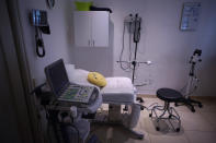 A smiley pillow sits on a gynecological table at Casa Fusa, a health center that advices women on reproductive issues and performs legal abortions, in Buenos Aires, Argentina, Friday, Jan. 22, 2021. Under the new abortion law that goes into effect Sunday, private health centers that do not have doctors willing to carry out abortions must refer women seeking abortions to clinics that will. Any public official or health authority who unjustifiably delays an abortion will be punished with imprisonment from three months to one year. (AP Photo/Victor R. Caivano)