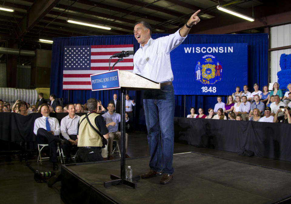 Republican presidential candidate, former Massachusetts Gov. Mitt Romney gestures during a campaign stop at Monterey Mills on Monday, June 18, 2012 in Janesville, Wis. (AP Photo/Evan Vucci)