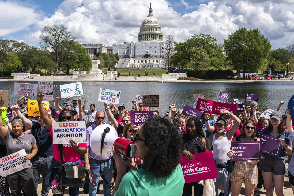 Protesters march past the U.S. Capitol following a Planned Parenthood rally in support of abortion access outside the Supreme Court on Saturday, April. 15, 2023, in Washington. (AP Photo/Nathan Howard)