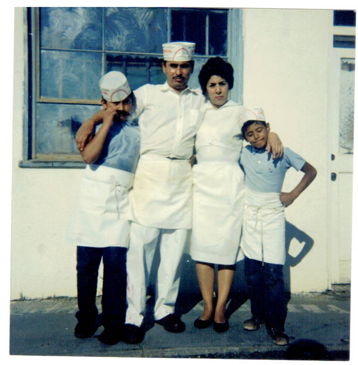 Miguel and Conception Unzueta, who founded Caballo Blanco in 1961, stand with their two sons, Ruben left, and Roy, who now run the restaurant.