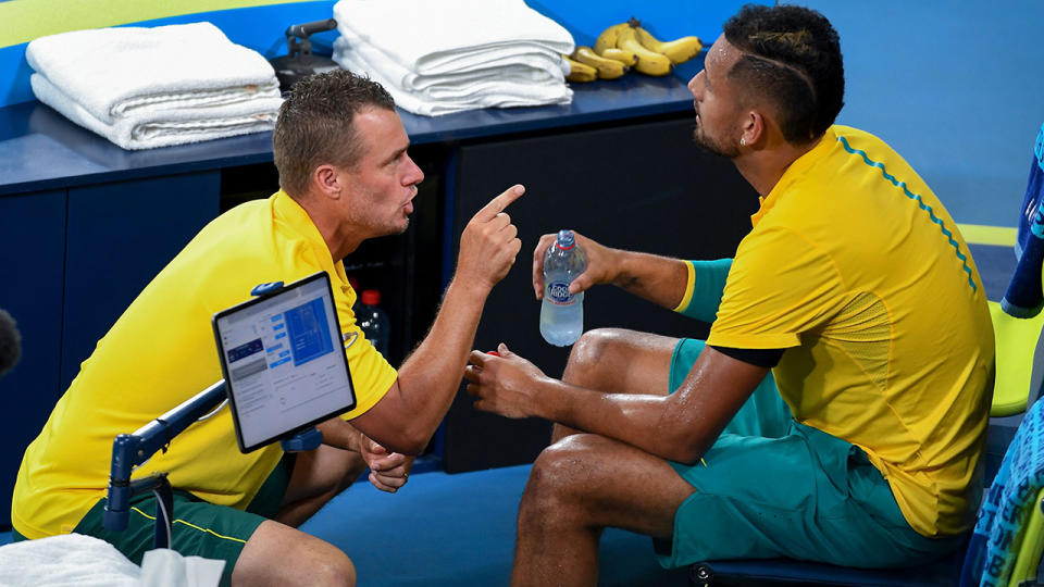 Lleyton Hewitt, pictured here speaking to Nick Kyrgios during his ATP Cup match.