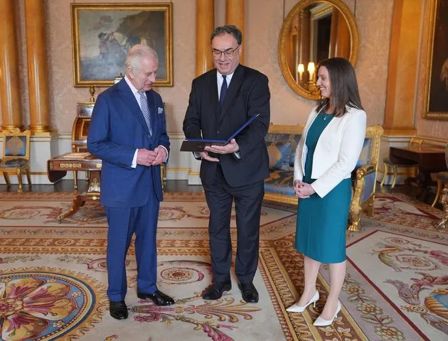 <p>Yui Mok - WPA Pool/Getty</p> King Charles, Bank of England Governor Andrew Bailey and Bank of England's Chief Cashier Sarah John at Buckingham Palace in London on April 9, 2024.