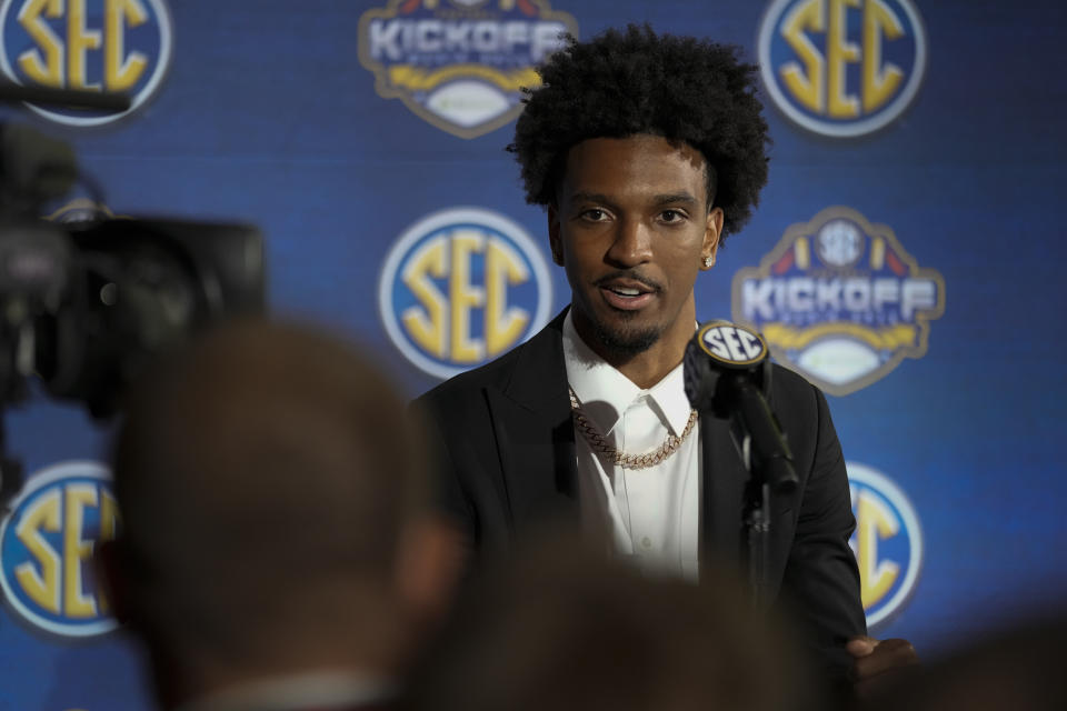 FILE - LSU quarterback Jayden Daniels responds to questions during NCAA college football Southeastern Conference Media Days, Monday, July 17, 2023, in Nashville, Tenn. LSU opens their season at Florida State on Sept. 3. (AP Photo/George Walker IV, File)