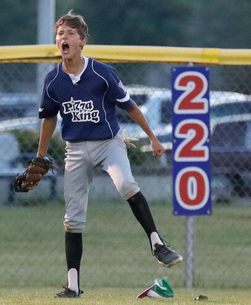 Pizza King’s Ethan Arft celebrates after a catch in center field against Waverly 51 during the Appleton Little League city championship baseball game Wednesday at Scheels USA Youth Sports Complex in Appleton.