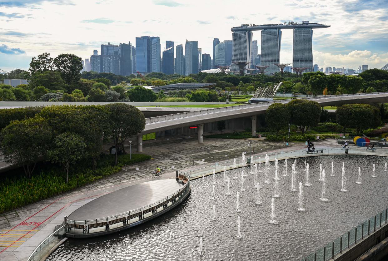 This picture taken from Marina Barrage shows water fountains with the city skyline in the background in Singapore on October 10, 2022. (Photo by Roslan RAHMAN / AFP) (Photo by ROSLAN RAHMAN/AFP via Getty Images)
