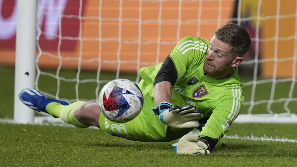 Real Salt Lake goalkeeper Zac MacMath makes a save on a penalty shot by Sporting Kansas City forward Alán Pulido during the second half of an MLS soccer match Saturday, Oct. 7, 2023, in Sandy, Utah. (AP Photo/Rick Bowmer)