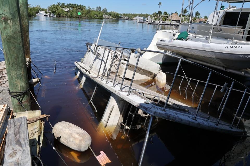 Residents and business owners of Everglades City clean up from Hurricane Ian.