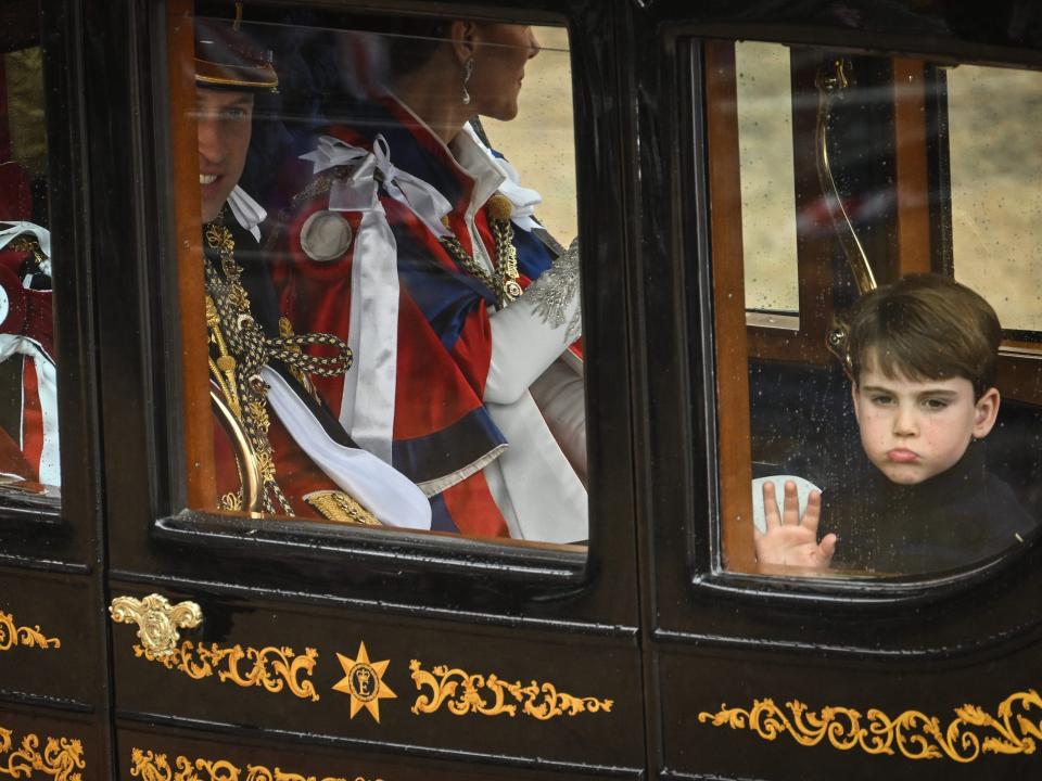 Prince Louis pulls a face as he leaves King Charles' coronation on May 6.