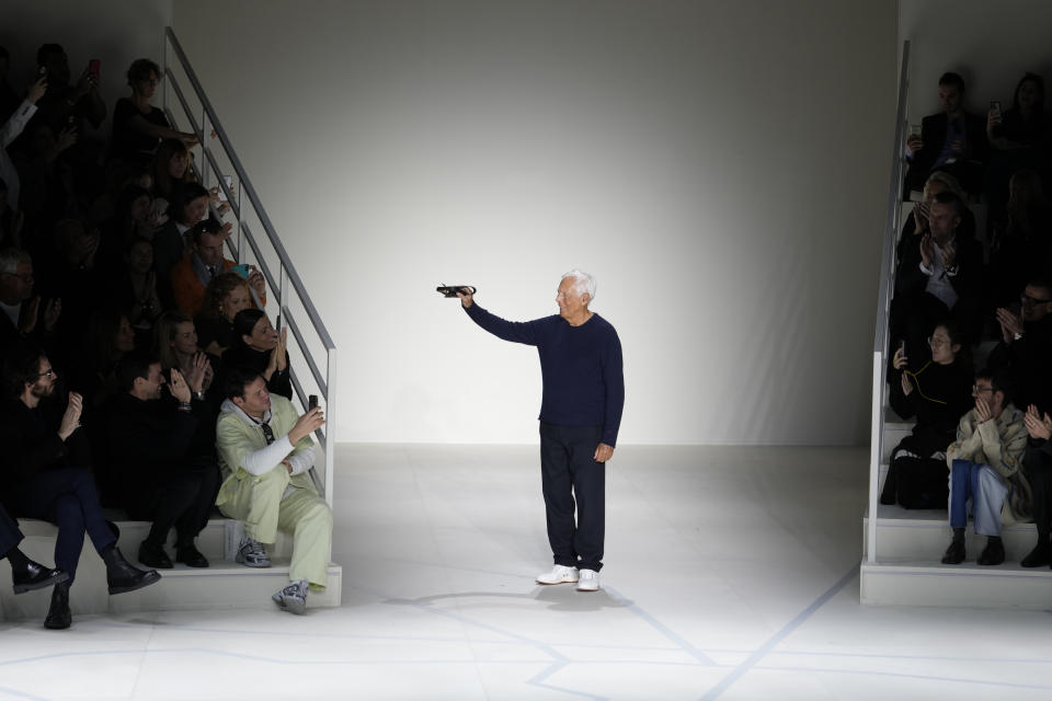 Giorgio Armani acknowledges the applause of the audience after presenting the Emporio Armani menswear Fall-Winter 2023-24 collection, in Milan, Italy, Saturday, Jan. 14, 2023. (AP Photo/Luca Bruno)