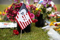 <p>A flag bearing an abbreviation for “Portland” stands at a makeshift memorial for two men who were killed on a commuter train while trying to stop another man from harassing two young women who appeared to be Muslim, in Portland, Ore., May 29, 2017. (Terray Sylvester/Reuters) </p>