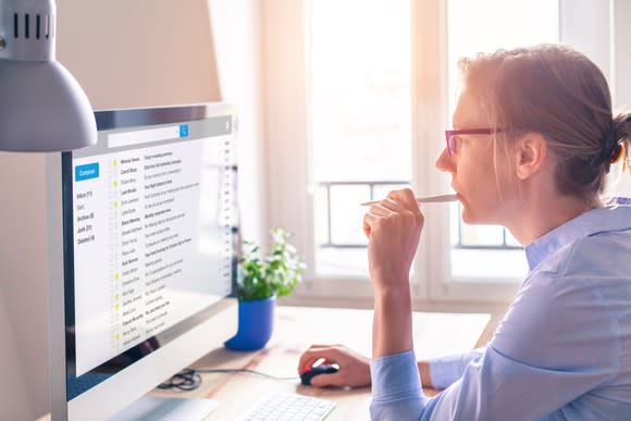 A woman at work at a computer.