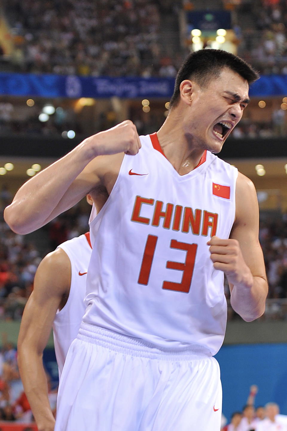 BEIJING - AUGUST 12: Yao Ming #13 of China celebrates against Spain during day 4 of the men's preliminary basketball game at the 2008 Beijing Olympic Games at the Beijing Olympic Basketball gymnasium on August 12, 2008 in Beijing, China. NOTE TO USER: User expressly acknowledges and agrees that, by downloading and/or using this Photograph, user is consenting to the terms and conditions of the Getty Images License Agreement. Mandatory Copyright Notice: Copyright 2008 NBAE (Photo by Garrett Ellwood/NBAE via Getty Images)