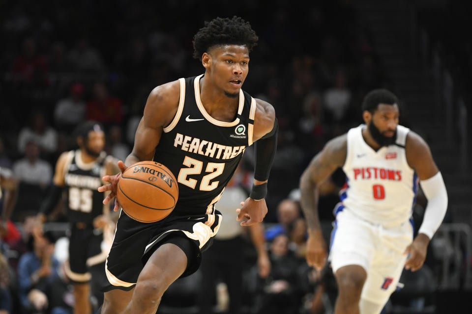 Atlanta Hawks forward Cam Reddish (22) brings a stolen ball upcourt during the first half of an NBA basketball game against the Detroit Pistons, Saturday, Jan. 18, 2020, in Atlanta. (AP Photo/John Amis)