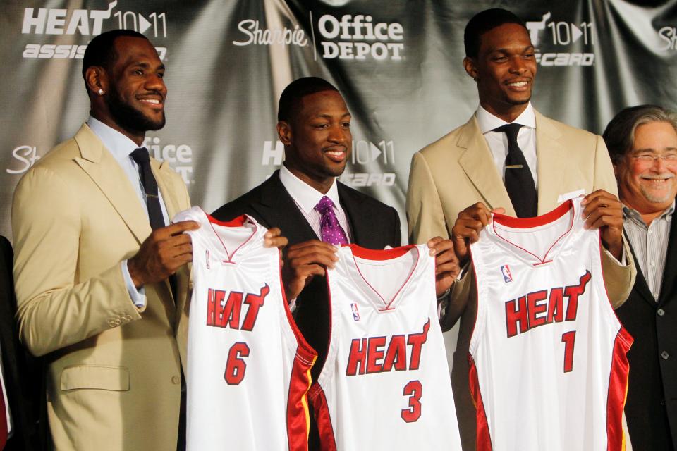 LeBron James (6), Dwyane Wade (3) and Chris Bosh (1) show off their Miami Heat jerseys at the American Airlines Arena in Miami, on July 9, 2010.