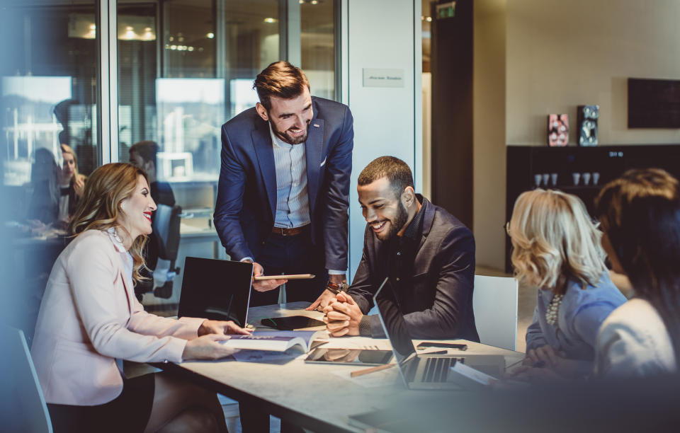 Colleagues working in office together