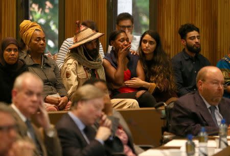Members of the public react at a Kensington and Chelsea Council meeting about Grenfell Tower at Kensington Town Hall in London, Britain July 19, 2017. REUTERS/Neil Hall