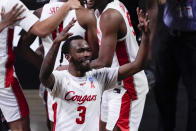 Houston guard DeJon Jarreau (3) celebrates beating Houston 67-61 after an Elite 8 game in the NCAA men's college basketball tournament at Lucas Oil Stadium, Monday, March 29, 2021, in Indianapolis. (AP Photo/Michael Conroy)