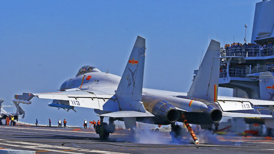 A People’s Liberation Army Navy J-15 fighter lands on the aircraft carrier <em>Liaoning</em> in April 2018. <em>AFP via Getty Images</em> <em>AFP via Getty Images</em><br>