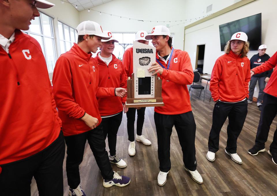 Crimson Cliffs players celebrate their win in the team championship during the 4A boys golf tournament at The Ridge Golf Club in West Valley City on Thursday, Oct. 12, 2023. | Jeffrey D. Allred, Deseret News