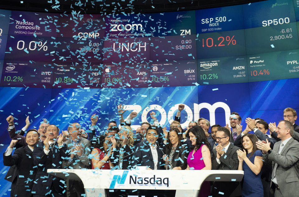 Employees and guests of Zoom celebrate at Nasdaq as the company holds its IPO, Thursday, April 18, 2019, in New York. The videoconferencing company is headquartered in San Jose, Calif. (AP Photo/Mark Lennihan)