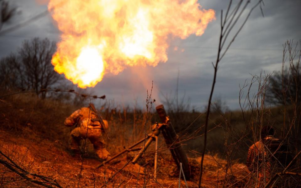 Ukraine's 56th brigade fires a mortar towards Russian positions near Bakhmut