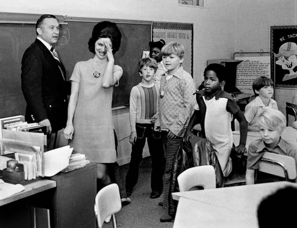 Mrs. Winford Crook, second from left, teacher at Old Center School, is rather surprised as Dr. Elbert D. Brooks, left, director of schools, stops at her classroom Oct. 4, 1972, to tell her she has been selected “Metro Teacher of the Year.”