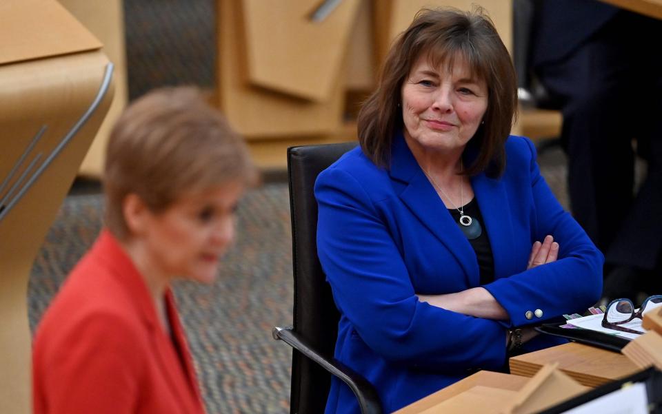 Scotland's Health Secretary Jeane Freeman listens to First Minister Nicola Sturgeon  -  JEFF J MITCHELL/AFP