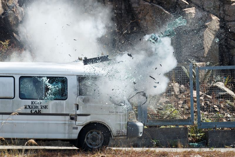 High explosives detonate inside a van at EOD depot of Hong Kong police during media tour in Hong Kong