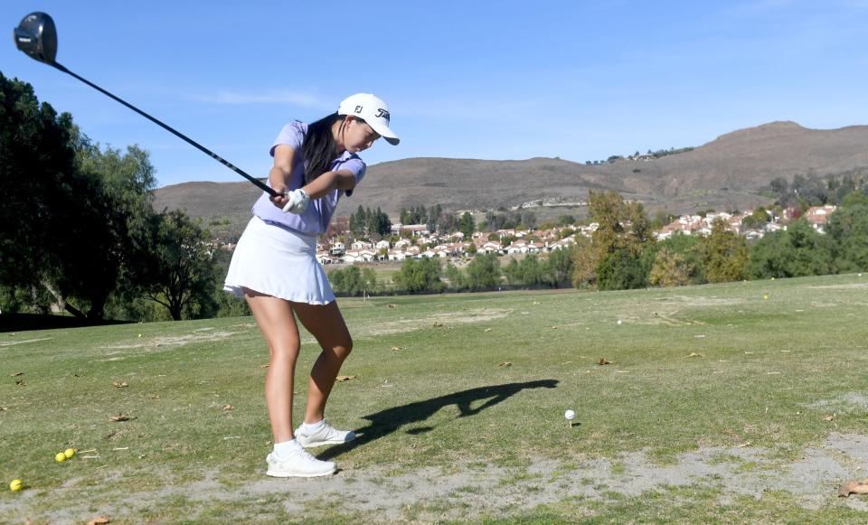 Oak Park senior Derica Chiu practices her swing at Wood Ranch Golf Club in Simi Valley on Nov. 23.
